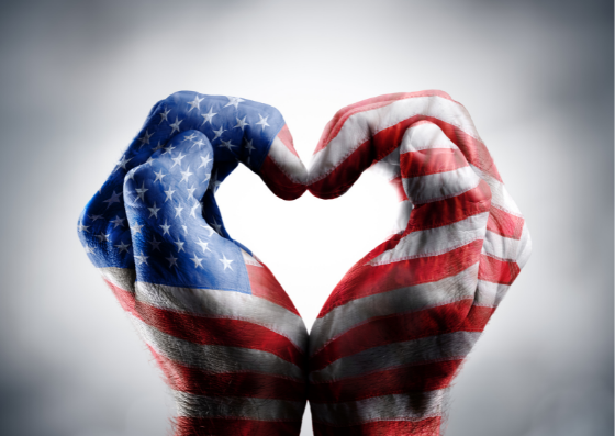 Hands in heart shape, painted with stars and stripes flag Hands in heart shape, painted with stars and stripes flag