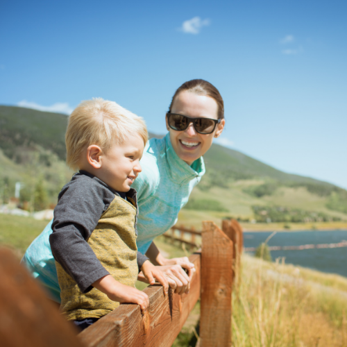 Mum and son near water in America