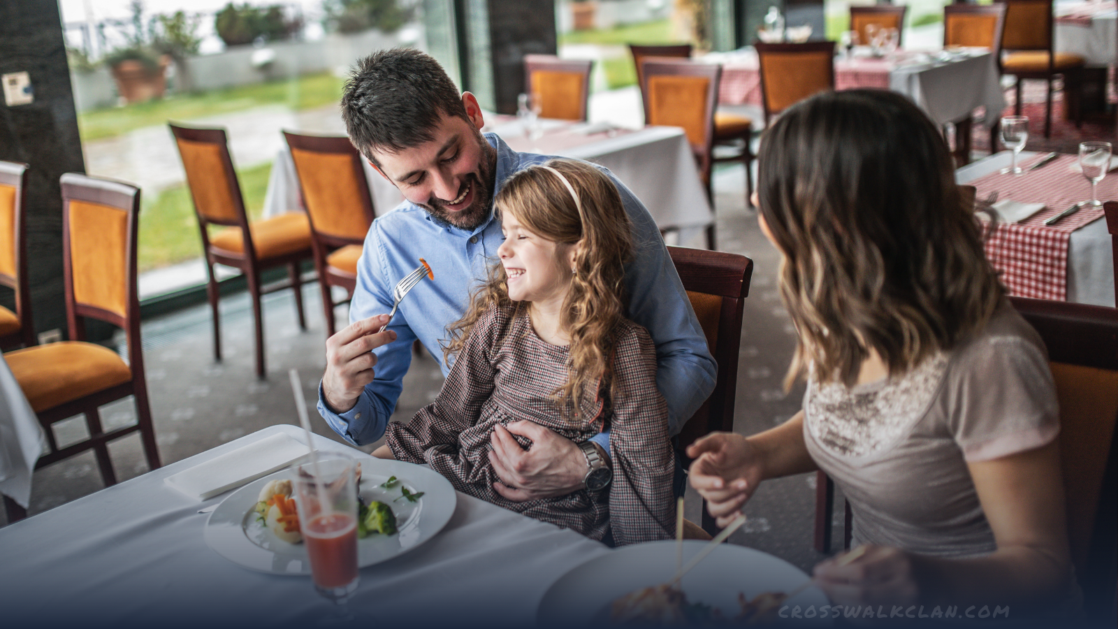 Family enjoying food together at an indoors restaurant